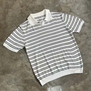 Black striped polo